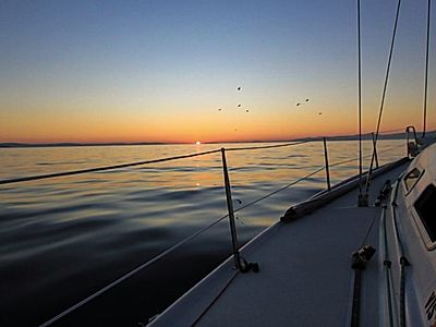 Private Sunset Sailing with transfers to and from Milna Bay